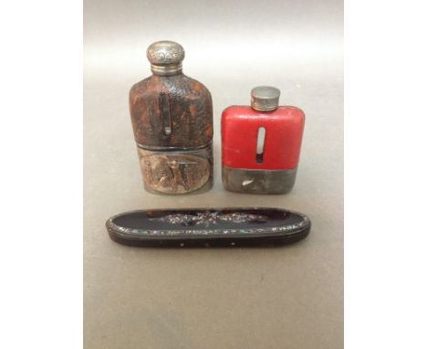 A silver plated golf related flask together with a pewter and leather flask and an Oriental ebonised wood and mother of pearl