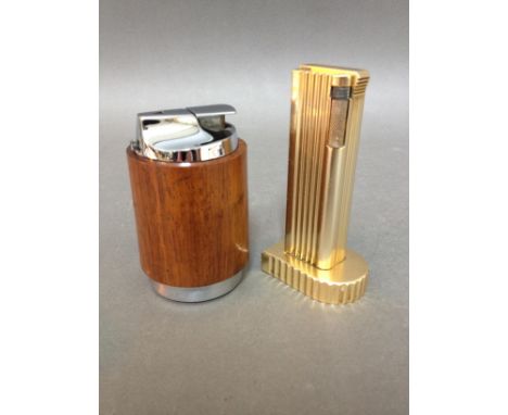 A vintage Ronson teak table lighter and a Benlow Golmet gilt table lighter. 