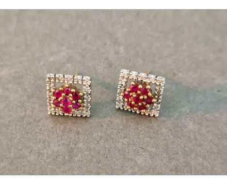 A pair of diamond and ruby earrings, marked '9K', gross wt. 2.2g. 