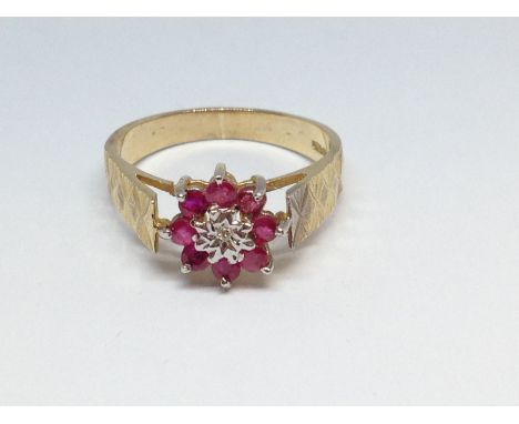 A diamond and ruby cluster ring, gross wt. 2.7g, size O. 