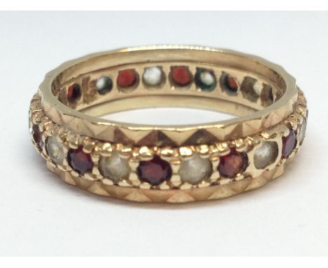 A hallmarked 9ct gold red and colourless stones ring, gross wt. 3.5g, size P. 