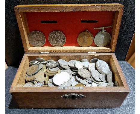 An oak money box containing a collection of assorted GB and world coins to include 2 Victorian crowns (1887 &amp; 1895), comm