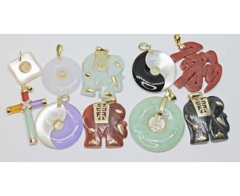 A group of ten hard stone pendants including jadeite jade, yellow metal mounts, some marked '14K', others unmarked. 