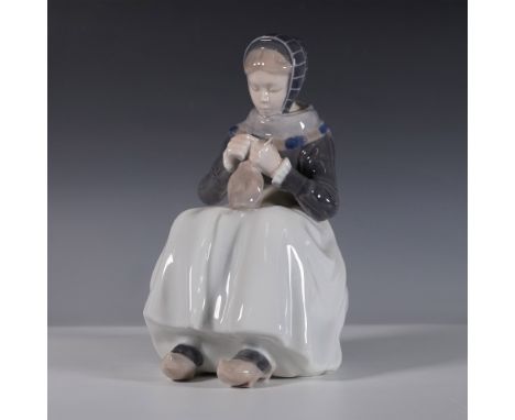Royal Copenhagen porcelain figurine titled The Knitter, style number 1317. This finely crafted piece features a young woman s