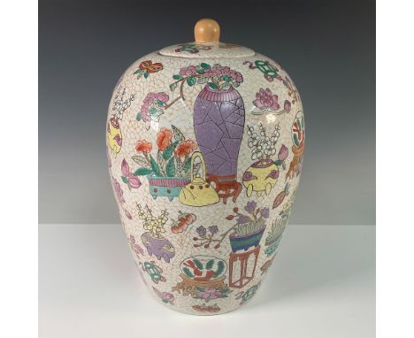 A finely decorated vintage Chinese porcelain jar with lid. This large jar features an intricate crackle glaze background with