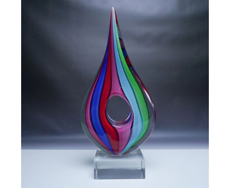 A striking hand-blown glass sculpture signed by Formia Murano, numbered 126/500. This elegant abstract piece features an elon