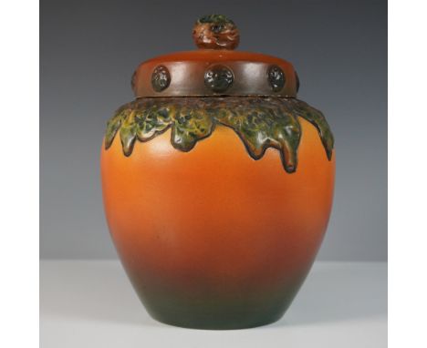 A striking Ipsen's Enke Pottery lidded jar from Denmark, model 784, featuring a rich gradient glaze transitioning from deep g