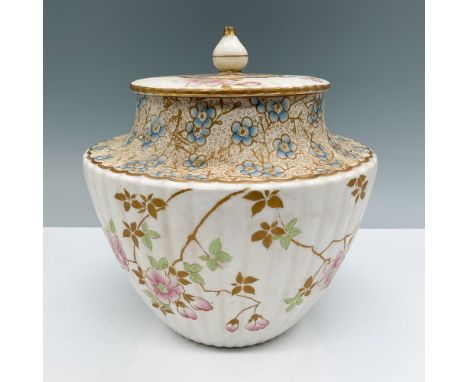 A delightful 7"H Doulton Burslem lidded jar featuring hand-painted floral patterns in vibrant hues of pink, green, and blue, 