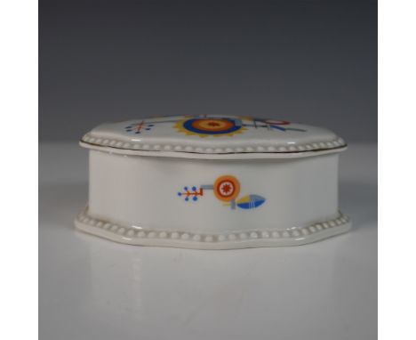 Rosenthal porcelain lidded box featuring a striking geometric pattern in vibrant hues of blue, orange, and yellow. The octago
