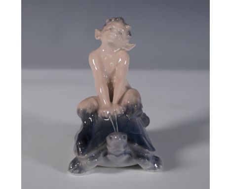 This finely crafted Royal Copenhagen porcelain figurine, model 858, depicts a whimsical faun sitting atop a tortoise. Designe