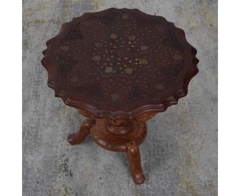This stunning handcrafted side table features a richly detailed floral and foliate motif inlaid with mother-of-pearl across i