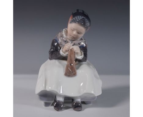 Elegant Royal Copenhagen porcelain figurine titled Amager Girl Knitting, style number 1314. This beautifully hand-painted pie