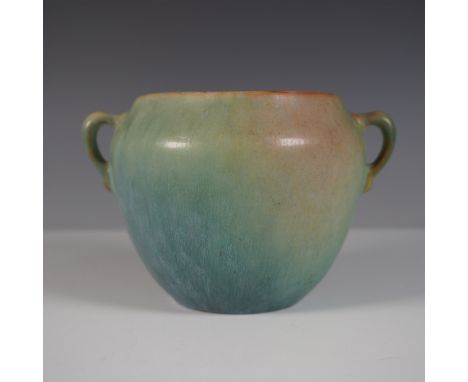 A Roseville Pottery Earlam squat vase featuring a rich matte green glaze with subtle variations in tone. This classic Arts an