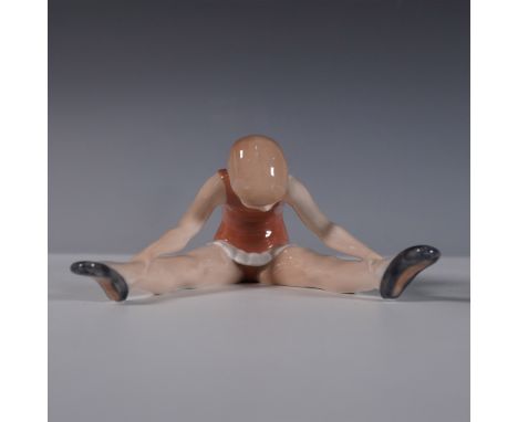 Graceful Royal Copenhagen porcelain figurine of a young ballet dancer, captured in a stretching pose. Designed with exquisite