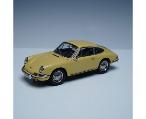 A meticulously crafted 1:18 scale model of the 1964 Porsche 901 Sportcoupe by CMC GmbH. This die-cast precision model feature