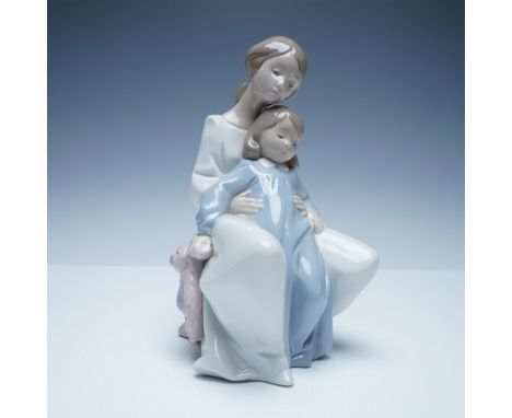 Heartwarming Nao by Lladro porcelain figurine depicting a mother tenderly embracing her child as they share a quiet moment to