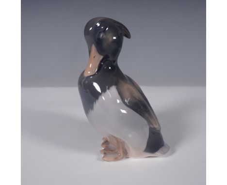 This elegant Royal Copenhagen porcelain figurine depicts a standing duck, beautifully crafted with fine details and a refined