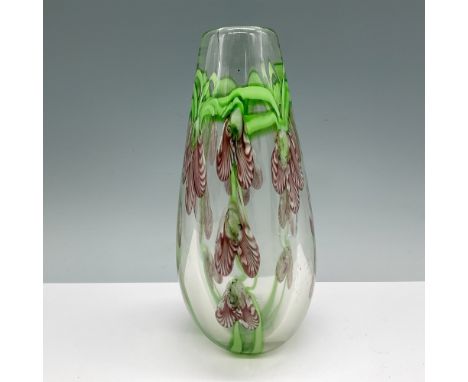 Unique art glass vase featuring a delicate floral design in green and maroon hues. The vase measures 7.75"H and showcases exq