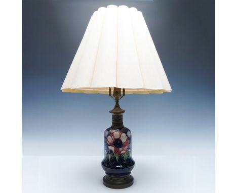 A Moorcroft pottery table lamp featuring the Anemone pattern, designed by renowned British ceramic artist William Moorcroft. 
