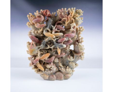 A striking hand-carved coral reef sculpture featuring an intricate depiction of fish and marine life in vivid detail. Measuri