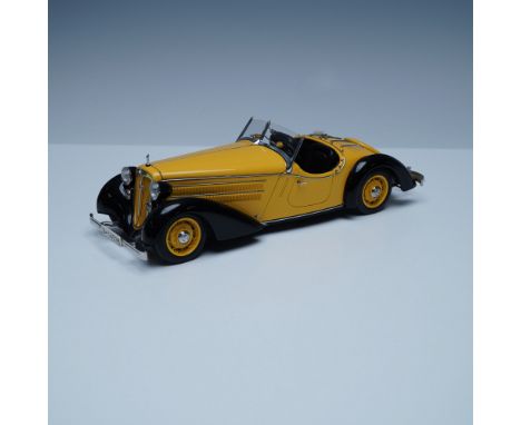 This limited edition CMC model replicates the 1935 Audi Front 225 Roadster with remarkable precision. Featuring a striking ye
