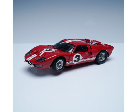 This detailed 1:18 scale Exoto Ford GT40 model replicates the legendary endurance race car that dominated Le Mans. Finished i