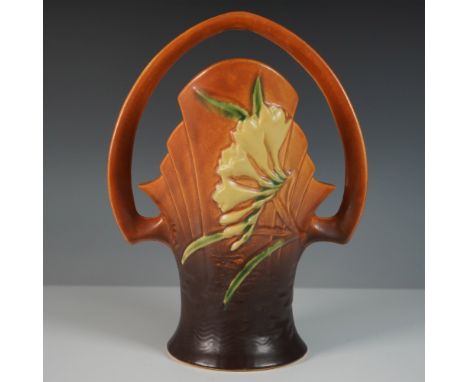 This Roseville Pottery Freesia basket is a striking example of the company’s signature Art Deco-influenced floral designs. Cr