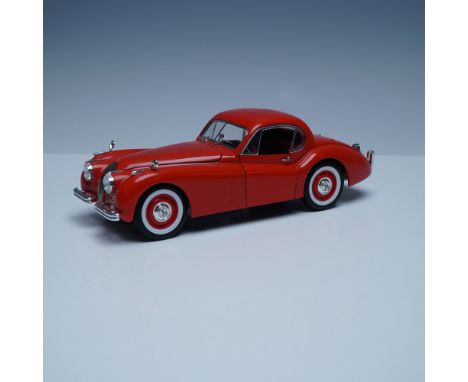A detailed 1:18 scale diecast model of the 1949 Jaguar XK 120, produced by Signature Models. This finely crafted replica feat
