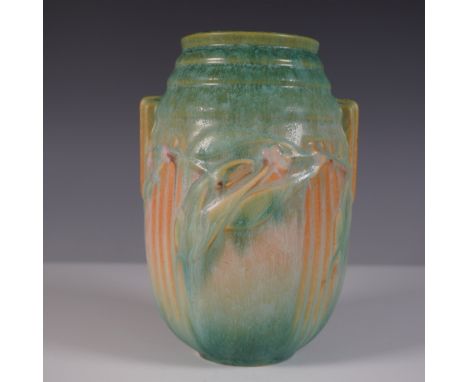A stunning Roseville Pottery Laurel vase featuring an elegant Art Nouveau-inspired floral relief design. This handled vase is