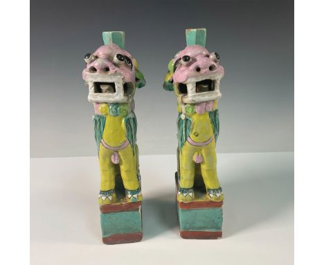 A pair of Chinese hand painted ceramic incense holders in the form of stylized Foo Dogs, showcasing vibrant polychrome glazes