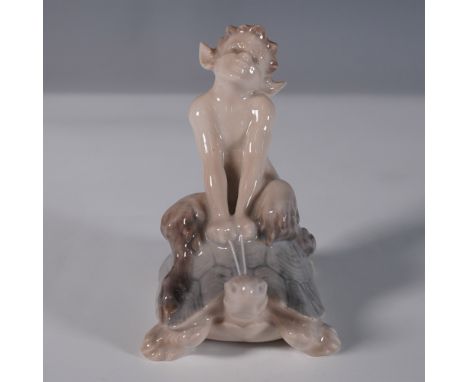 This Royal Copenhagen porcelain figurine, model 858, depicts a charming faun joyfully riding atop a tortoise. Designed in a n