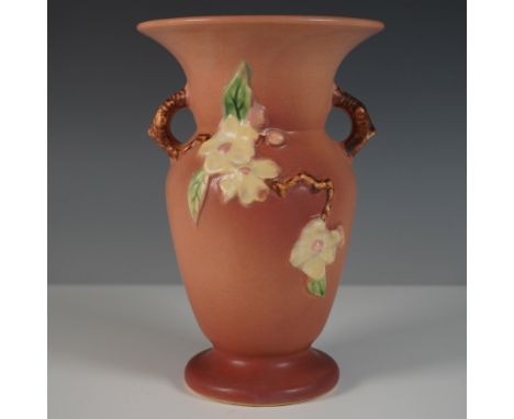 Charming Roseville Pottery vase in the Apple Blossom pattern, featuring a rich matte glaze in warm earth tones with raised fl