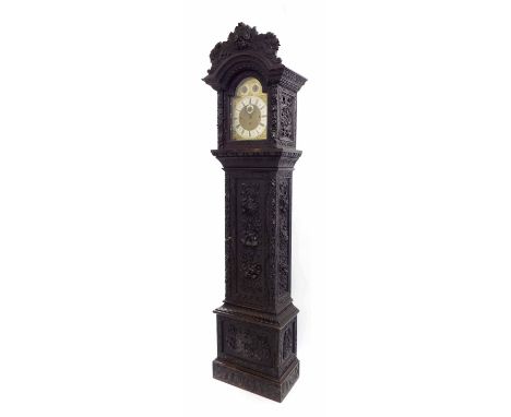 Ebonised oak eight day three train longcase clock, the 12" brass arched dial with silvered chapter ring enclosing a matted ce