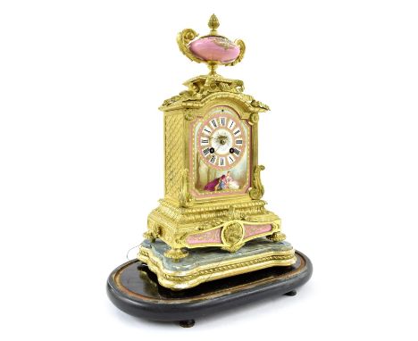 Good French ormolu and porcelain two train mantel clock striking on a bell, the porcelain arched dial painted with a courting