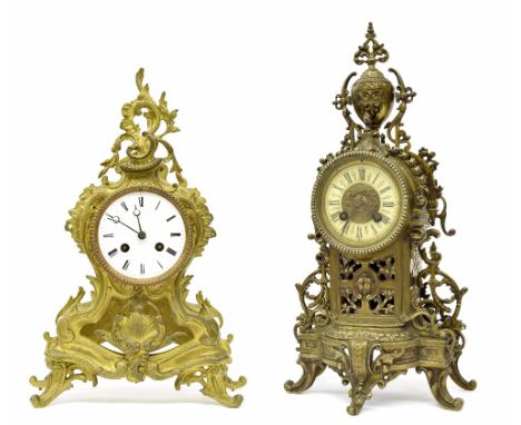 French brass two train mantel clock striking on a bell, within an ornate foliate pierced case surmounted by an urn finial, 17