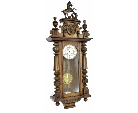 Vienna style walnut two train regulator wall clock, the 5" white dial within a glazed turned pillared case surmounted by a ca
