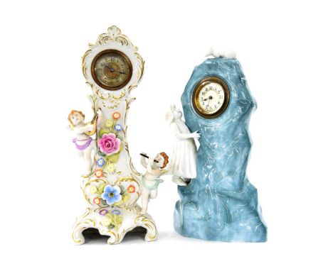 Novelty pottery miniature longcase clock, encrusted with flowers and applied with two musical winged cherubs, 12.5" high; als