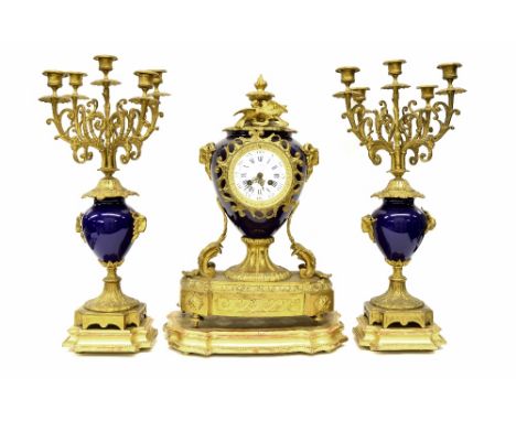 French ormolu and cobalt blue porcelain mounted two train mantel clock garniture, the movement backplate stamped Vassy... Par