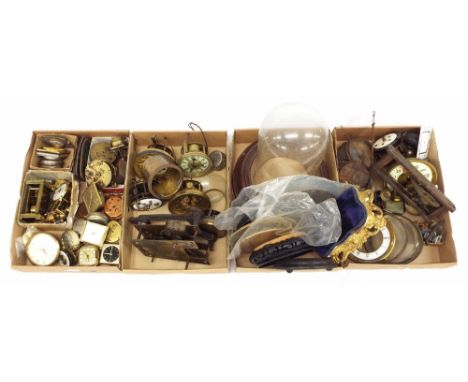 Four trays of old clock movements and various travelling alarm clocks etc