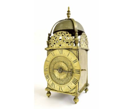 Early English brass lantern clock, the 6.25" chapter ring enclosing a foliate engraved centre with single iron hand and engra