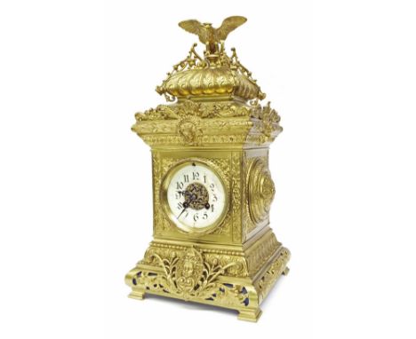 French ornate brass two train mantel clock, the S. Marti movement striking on a gong, the 4" cream dial enclosing a pierced f