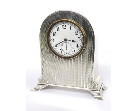 Small silver cased mantel clock timepiece, within a rounded arched case, 4.25'' high approx (at fault, hallmarks rubbed, move