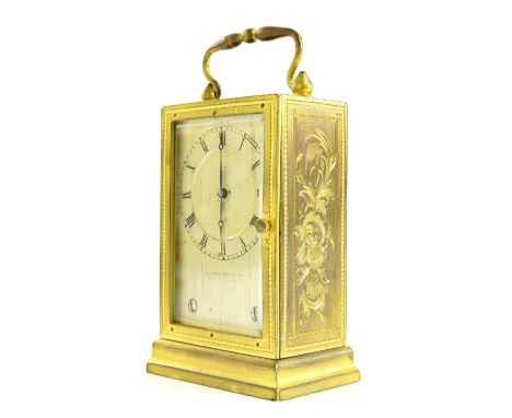 Unusual Continental gilt metal carriage clock timepiece, the vertical sliding back door opening to reveal a Swiss movement in