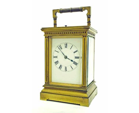 Gilded brass repeater carriage clock striking on a gong, within a pillared stepped case, 8" high; also with outer Morocco lea