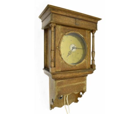 Oak thirty hour hooded wall clock, the 10" circular brass dial signed J.Gadsby, Leicester, with centre alarm dial, within a s