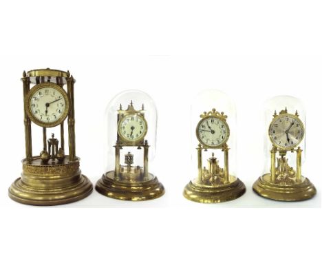 Brass torsion clock, the 2.75" cream dial over a disc pendulum supported upon a circular stepped base and under a glass dome,