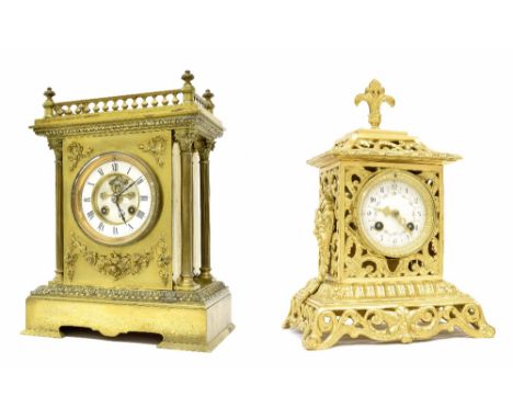 French brass two train mantel clock striking on a gong, the 3.75" white chapter ring enclosing a visible recessed escapement,