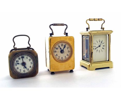 Contemporary miniature brass carriage clock, 4.25" high; also two small brass cased alarm clocks (3)