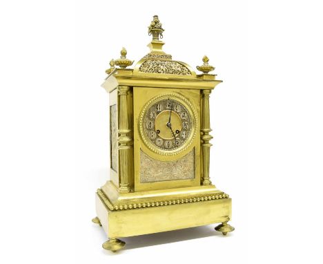French brass two train mantel clock striking on a gong, the 4" silvered chapter ring with Arabic numerals enclosing a matted 