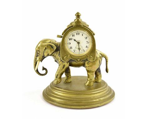 Novelty brass eight day elephant mantel clock timepiece, the 1.75" white dial with  subsidiary seconds dial, within an howdah